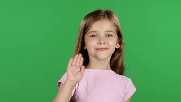 Baby Is Waving To Others. Green Screen