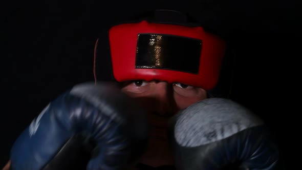 Angry Male Boxer on a Black Background