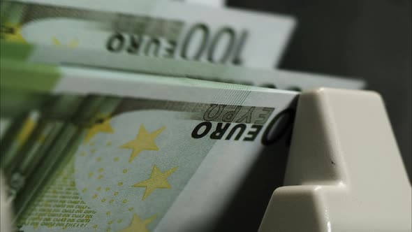 Calculating Machine for Money Counting One Hundred Euro Banknotes Closeup