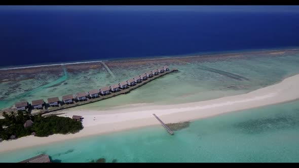 Aerial view seascape of idyllic bay beach break by shallow ocean with white sand background of journ