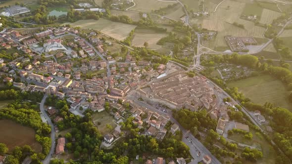 High view of an historical medieval city during a sunset, Italy