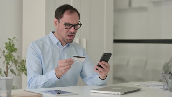 Middle Aged Man Having Online Payment Failure on Smartphone