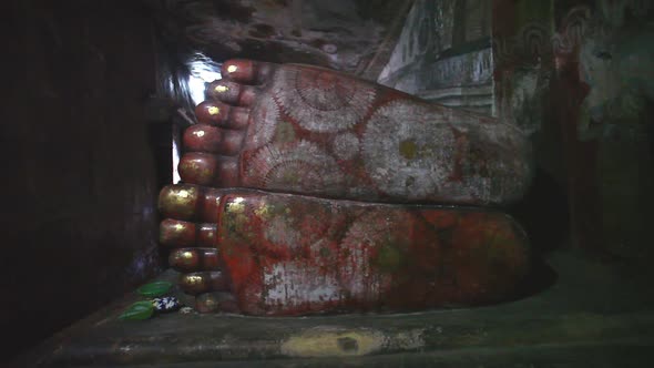 DAMBULLA, SRI LANKA - FEBRUARY 2014: The view of a sleeping Buddha's feet at the Golden Temple of Da