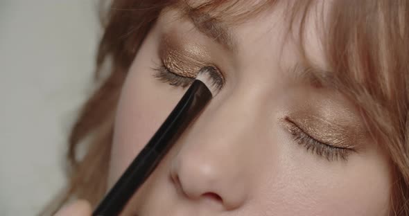 Woman With Eye Shadow Being Applied