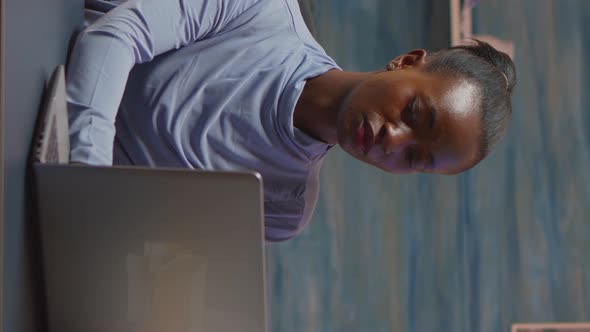 Vertical Video Africanamerican Woman Looking at Camera Smiling Working at Pc