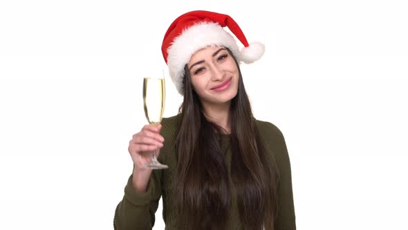 Portrait of Positive Woman Being Happy with Celebrating New Year Wearing Santa Claus Red Hat