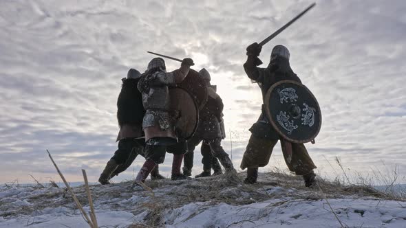 Warriors of Vikings Are Fighting During Attack at Winter Time.