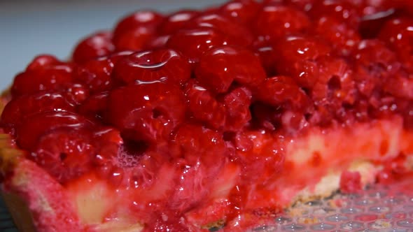 Sliced Raspberry Pie with Jelly on the Table