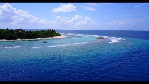 Aerial flying over landscape of beautiful shore beach time by shallow water with white sand backgrou