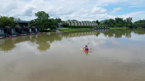 Couple Men and Women in Kayak on the River Kwai in Thailand