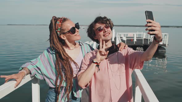 Couple Taking Selfie on Pier