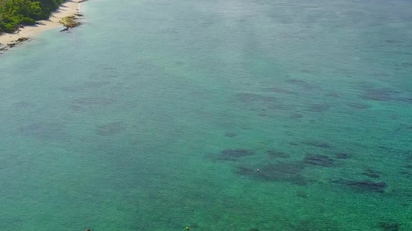 Close up seascape of tropical shore beach by ocean and sand background near reef