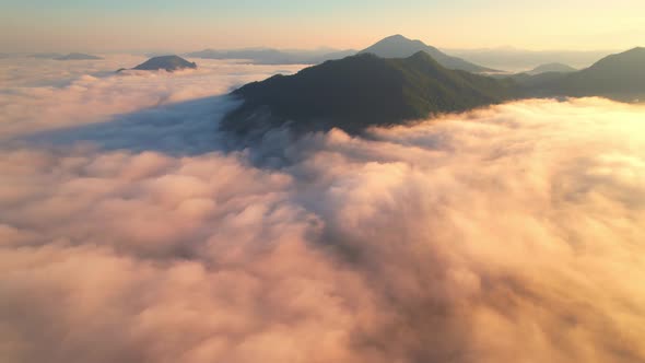 4K Aerial video Beautiful sunrise above dense clouds and fog in the morning