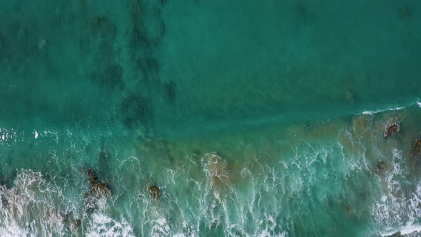 Aerial top view of Waves in Calm Sea. Fly over ocean water. Beautiful nature background 