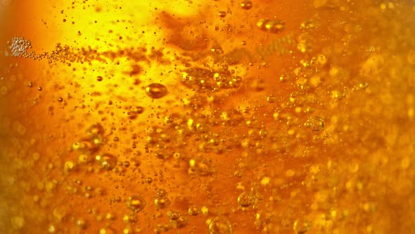 Super Slow Motion Detail Shot of Beer Bubbles in Glass at 1000Fps