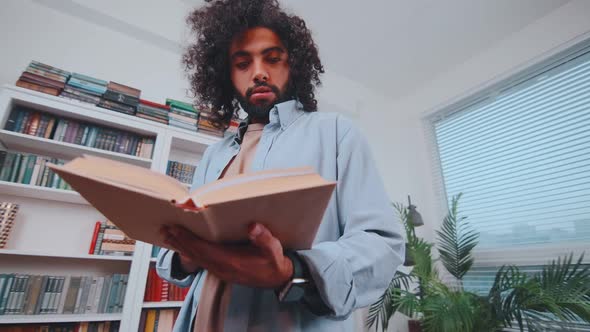 Young Arabian Man Student Reads Book Preparing for Exam at University