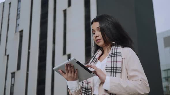 Businesswoman Receiving Good News on Tablet. Winner Girl Celebrating Victory