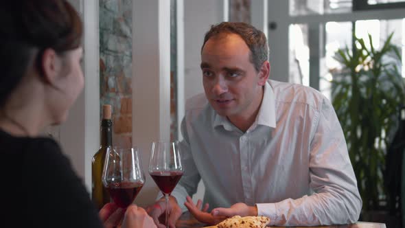 Husband and Wife at Dinner, Husband Tells a Story