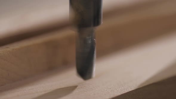 Macro Video of Drilling Holes in the Board with a Drilling Machine