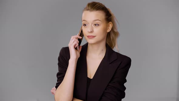 Confident Businesswoman Talking on Smartphone