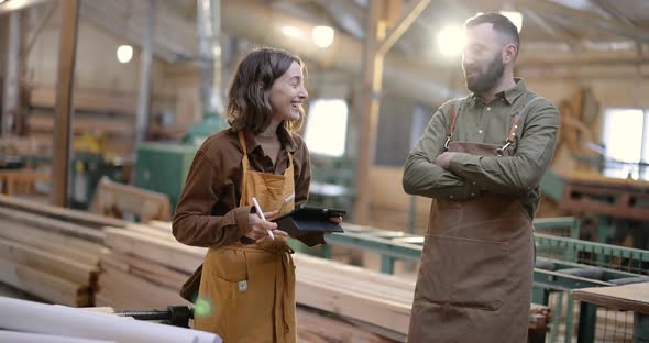 Cheerful Carpentry Workers at the Manufacturing