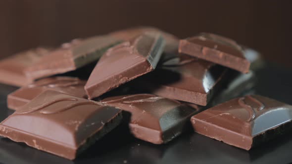A Pile of Chocolate Pieces Rotate Closeup