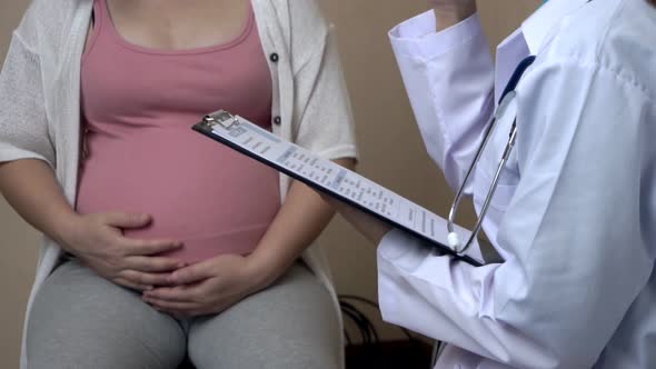 Pregnant Woman and Gynecologist Doctor at Hospital