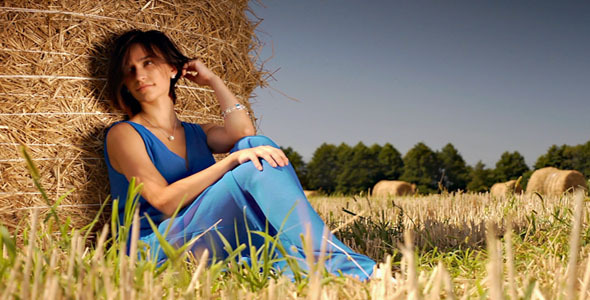 Beatiful Girl Posing In Hay Field