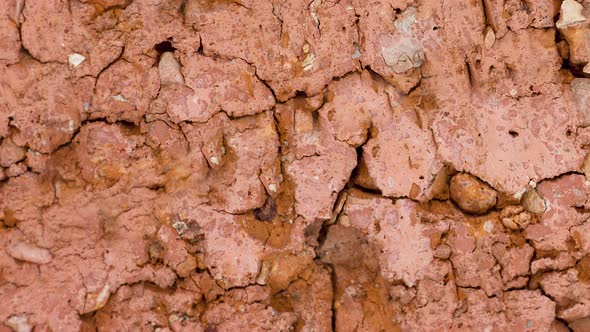 Texture of Cracked Red Old Brick Closeup