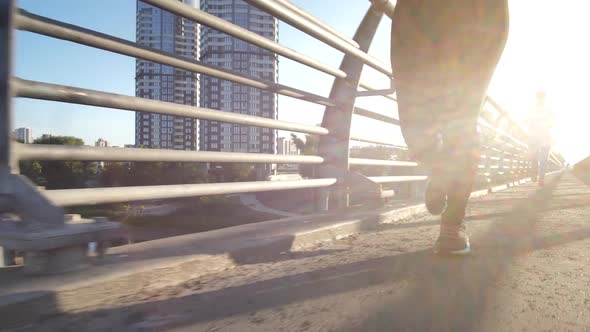 Active Urban Joggers Training Outdoors in Sunlight