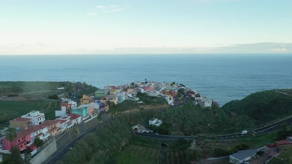 flying over a village on the coastline of Tenerife Spain 4k cinematic