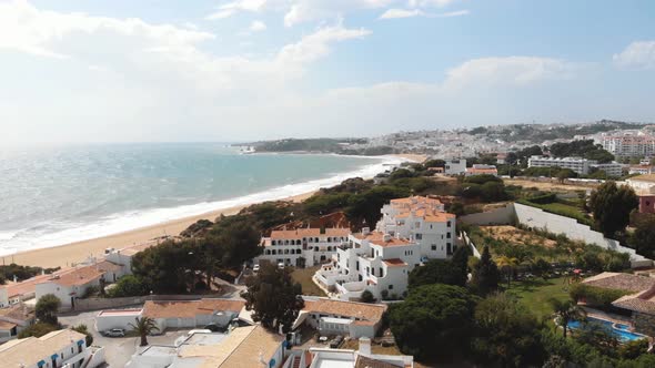 Aerial view of Albufeira beach and Atlantic Ocean on sunny day.