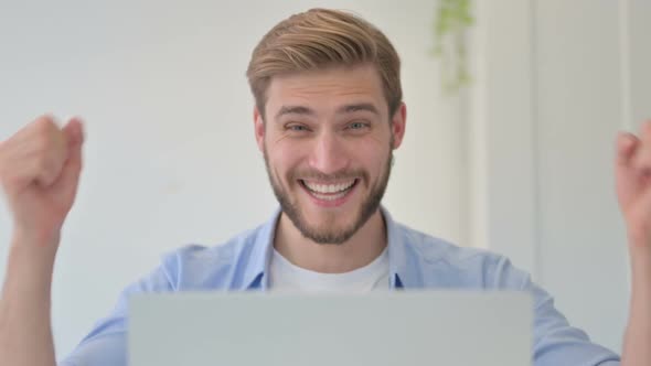 Portrait of Creative Man with Laptop Having Loss Failure