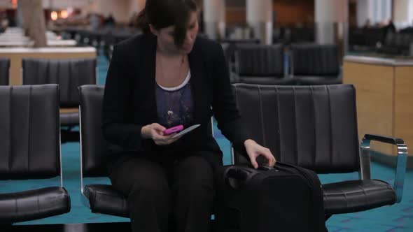 Woman waits in airport lobby