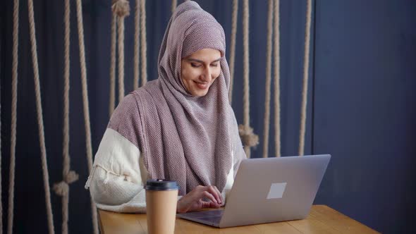 East Woman in Hijab Chatting with Friends