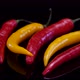 Hot chilli peppers isolated rotating on a black background.  - VideoHive Item for Sale