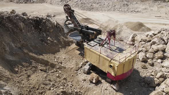 Heavy Equipment Loads Limestone Into The Machine