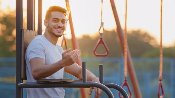 Confident Healthful Millennial Middle Eastern Arab Athletic Guy Invites you to Go in for Sports