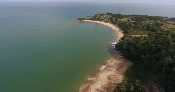 Aerial view of Mermaids Bay with waves slowly rolling in San Pedro Ivory Coast in Southwest Africa