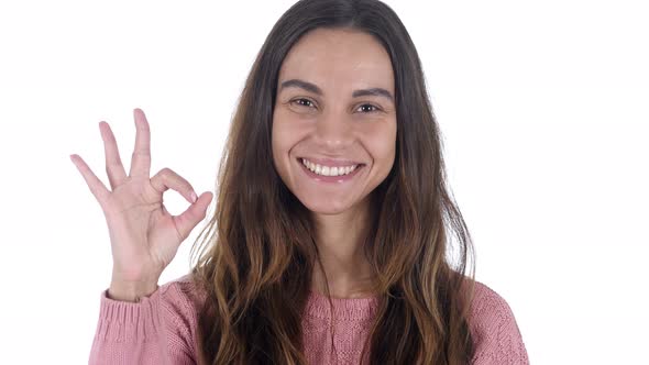 Okay Sign by Young Latin Girl, White Background