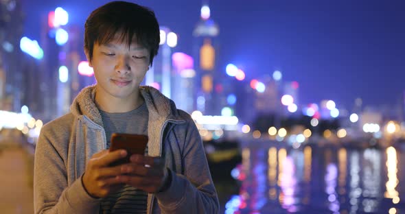 Asian Man Use of Smart Phone at Night