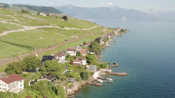 Aerial of houses at lake in beautiful Swiss countryside