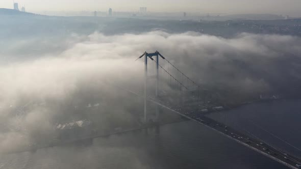 aerial video of bosphorus Bridge on a foggy day in Istanbul, Turkey. July 15 Martyrs Bridge 04