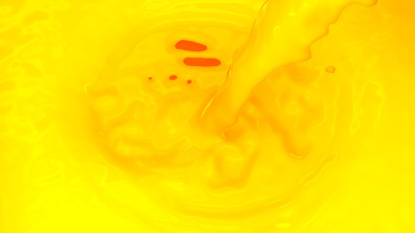 Pouring Mango Juice Into Mango Juice Swirl alt