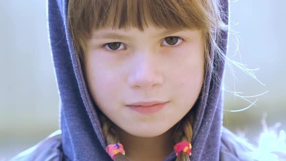 Portrait of Happy Child Girl in Warm Clothes in Autumn Outdoors