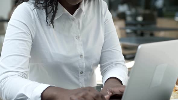 Attractive African American Woman Working with Laptop.