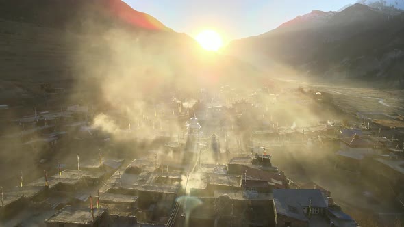 Flying over the village of Manang towards the sunset