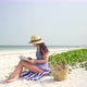 Young Caucasian Woman Reading Book On The Beach - VideoHive Item for Sale
