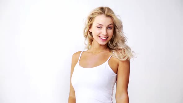 Happy Smiling Beautiful Young Woman in White Top