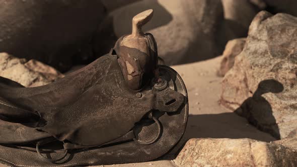 Very Old Horse Saddle on Sand Beach